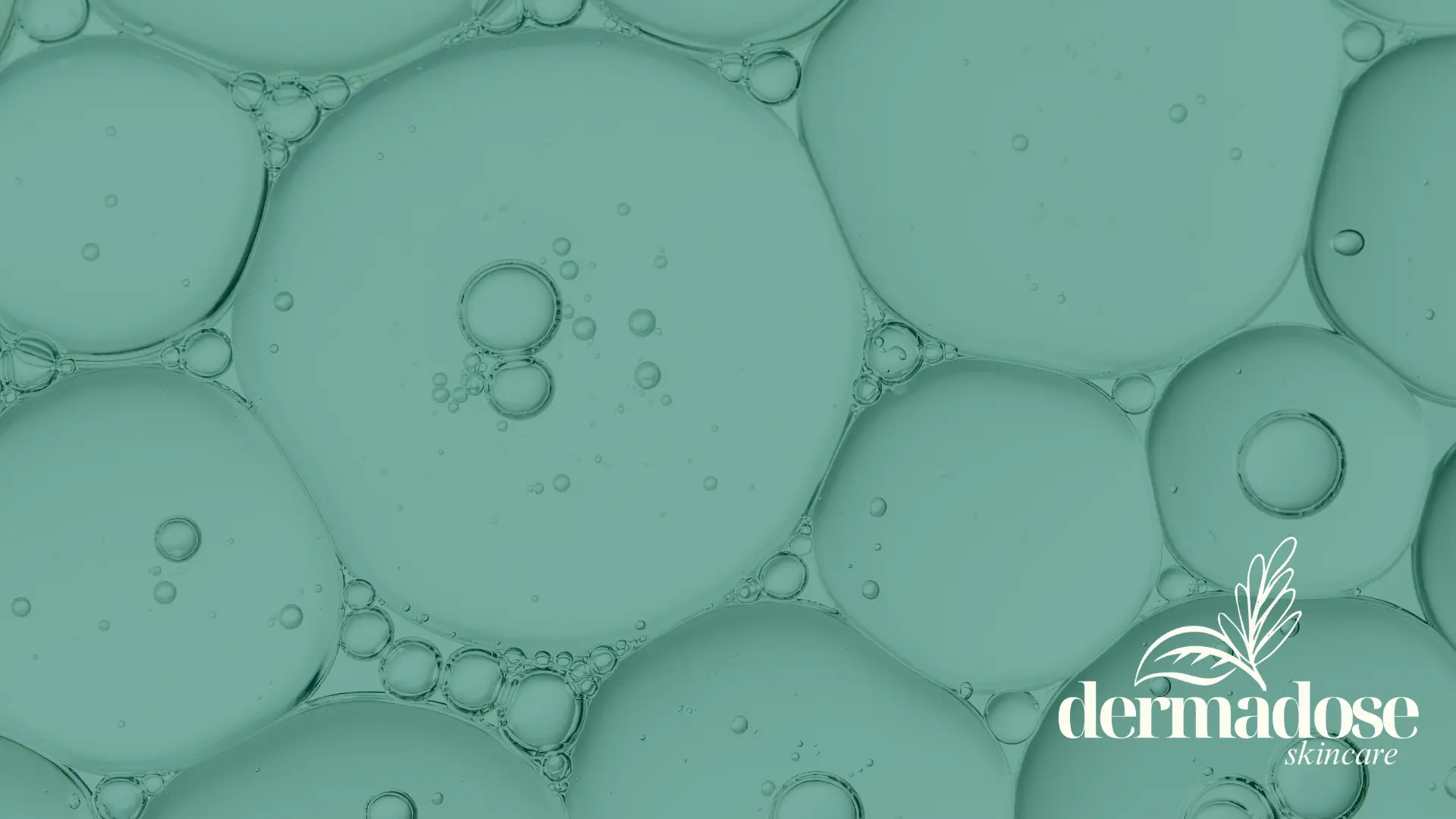Burbujas de aceite en agua en tonos verdes representando la textura de ácidos exfoliantes como el ácido salicílico o el ácido azeláico para piel con acné
